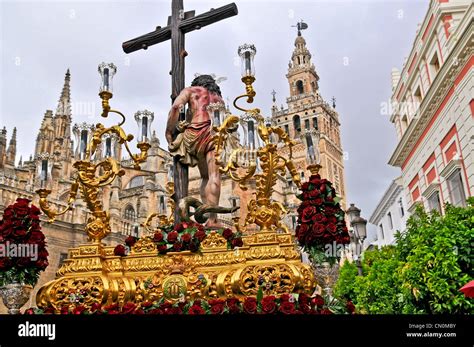 Spain Seville Semana Santa Holy Week Easter A procession entering the Cathedral with a paso or ...