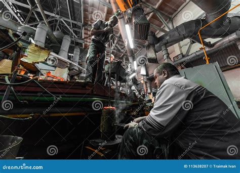 Minsk, Belarus - February 01, 2018: Glass Factory Workers on Production of Glass Background ...