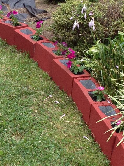 Painted cinder blocks as an edge for landscaping | Cinder block garden, Backyard landscaping ...