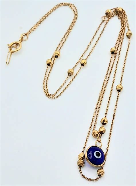 An 18K Yellow Gold Evil Eye Choker Necklace. 38cm length… | Drouot.com