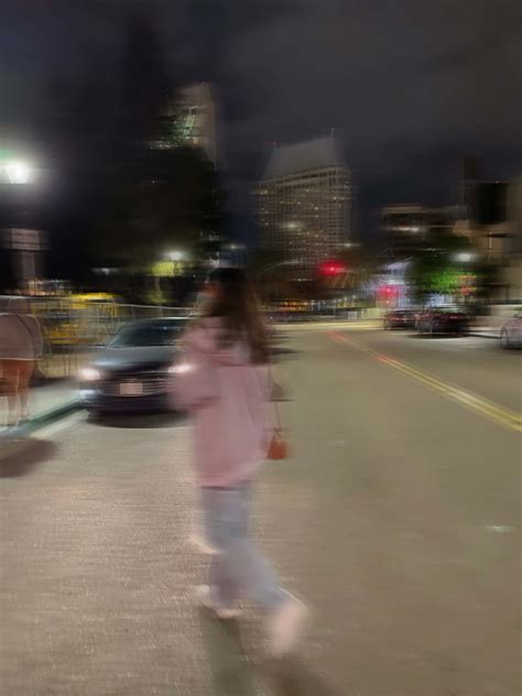 Download Blurry Girl Walking On Road Picture | Wallpapers.com