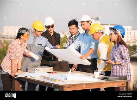 Group of engineers and architects discuss at a construction site, Architecture and Engineering ...