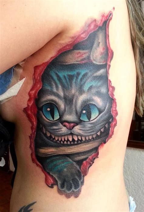 Creepy cheshire cat tattoo in skin rip - Tattooimages.biz