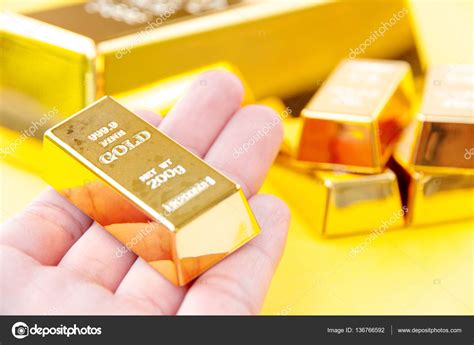 Gold bars background Stock Photo by ©ponsulak 136766592