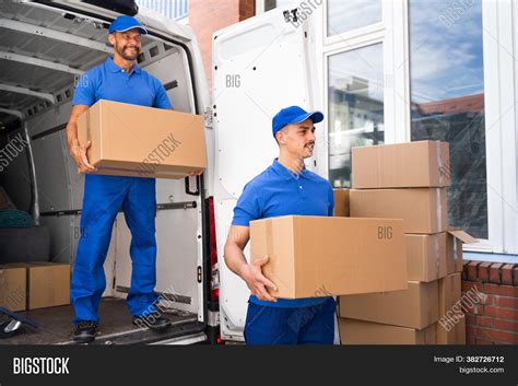 Truck Movers Loading Image & Photo (Free Trial) | Bigstock