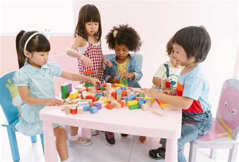 Premium Photo | Group of diversity kids playing with colorful blocks on table in class at the ...