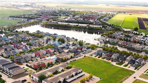 an aerial view of houses and water in the suburbs of a small town stock photos