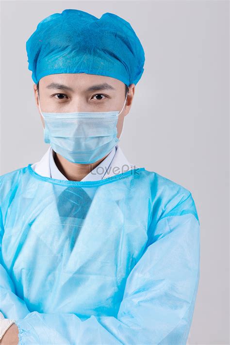 A Surgeon Wearing A Mask And A Surgical Suit Picture And HD Photos ...