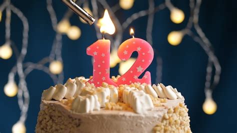 Premium Photo | Birthday cake with 12 number pink candle on blue ...