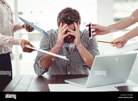 Businessman stressed out at work Stock Photo - Alamy