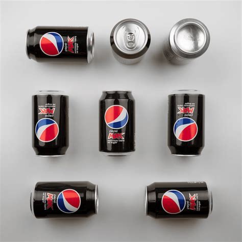 Soda Cans on a White Surface · Free Stock Photo