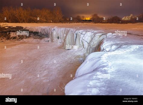 Frozen waterfall at night. Light painting illumination Stock Photo - Alamy