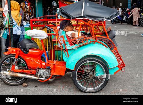 A Motorcycle Taxi Driver Resting, Malioboro Street, Yogyakarta, Java, Indonesia Stock Photo - Alamy