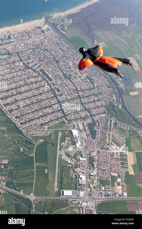 Man wingsuit flying over Empuriabrava, Spain Stock Photo - Alamy