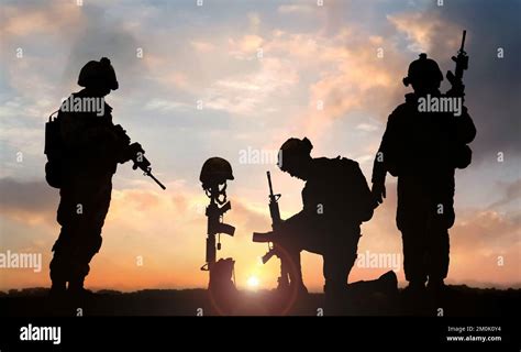 Silhouette Of A Soldier Kneeling In Respect For A Fallen Poster ...