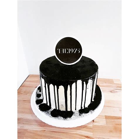 The 1975 black drip cake www.sugarandbloomcakestudio.co.uk | 18th cake, Drip cakes, Cake