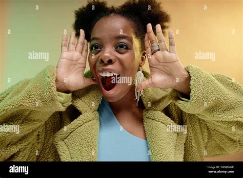 Happy woman shouting and gesturing against gradient background Stock Photo - Alamy