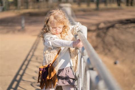 Little Girl Walking Alone in the City Park and Enjoy. Stock Photo ...