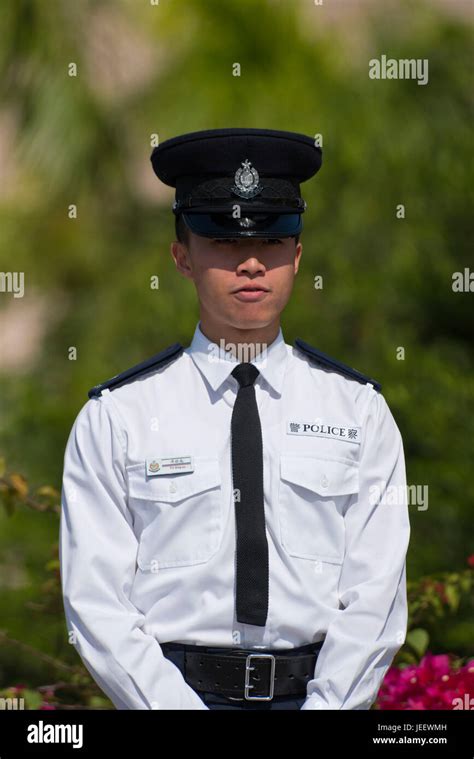 Vertical portrait of a policeman in Hong Kong, China Stock Photo - Alamy