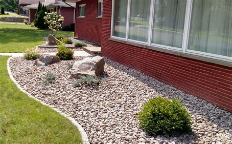 low maintenance foundation planting with stone mulch and paver edging Backyard Pool Landscaping ...