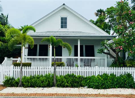 Key West Cottage living in the Heart of Old Town Key West. The front porch is an important part ...