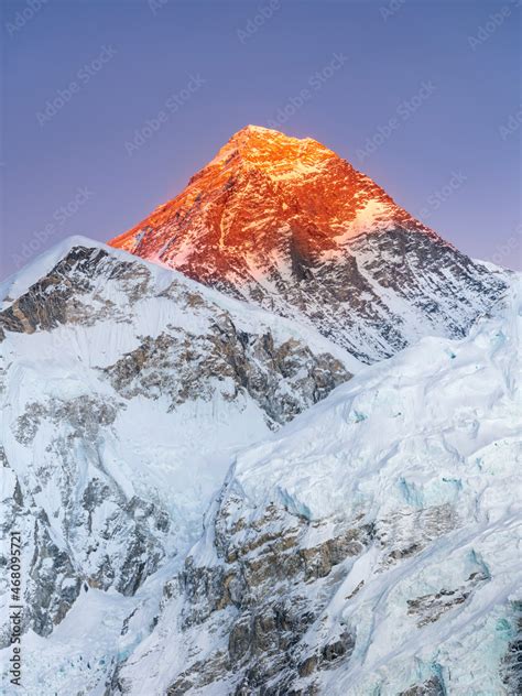 view to Mount Everest in sunset light under blue sky in vertical frame ...