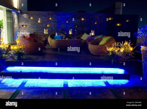 Romantic candle light private dinner, party setup in a restaurant with sofa table and furniture ...