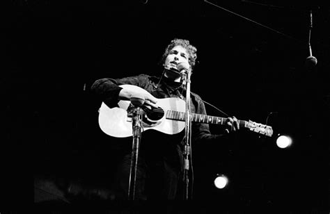 Bob Dylan performing on stage at night, Newport Folk Festival, Newport ...