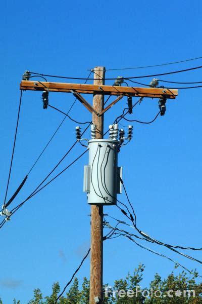 Electricity Transformer mounted on a Utility Pole pictures, free use image, 13-20-72 by FreeFoto.com