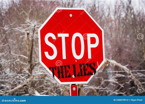 A Stop Sign at the End of a Small Country Road, Spray Painted with ...