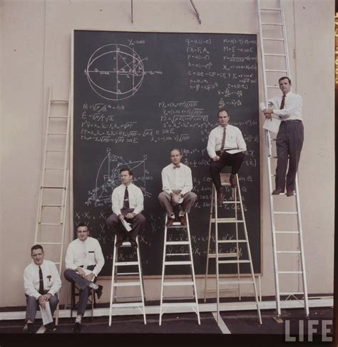 NASA scientists with their board of calculations, 1961