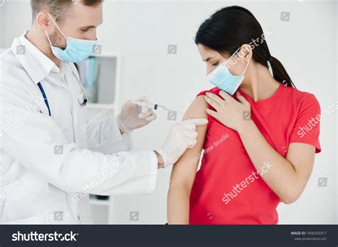 Male Doctor Makes Injection Into Arm Stock Photo 1906595917 | Shutterstock