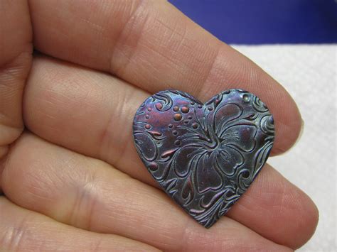 After adding a Liver of Sulfur Patina. Look at the beautiful colors on Pure Silver! Bright ...