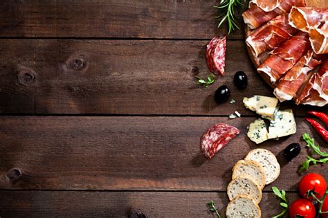 Appetizer Border On Rustic Wood Table Stock Photo - Download Image Now - iStock