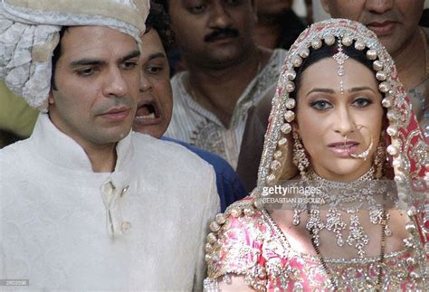 Indian film actress Karishma Kapoor (R) and her new husband Sanjay ...