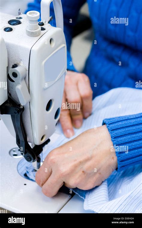 Hands work a sewing machine Stock Photo - Alamy