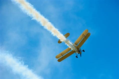 Royalty Free Airplane Stunt Old Fashioned Fighter Plane Pictures, Images and Stock Photos - iStock