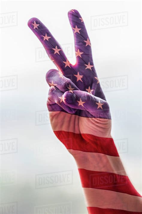 Hand of Caucasian man with American flag gesturing peace - Stock Photo ...