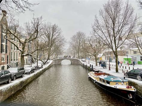 Snow and frozen canals in Amsterdam - Winter 2021 | Velvet Escape