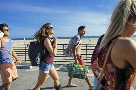 Group of friends, walking towards beach stock photo