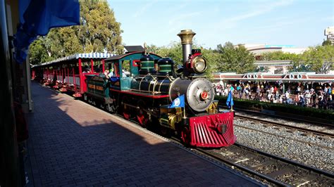 E.P. Ripley, Disneyland Railroad No. 2 pulls into Main Street Station decorated for Disneyland's ...