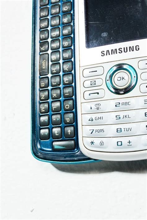 TE063 White Samsung Sliding Keyboard Mobile Phone Prop Rental - ACME Brooklyn