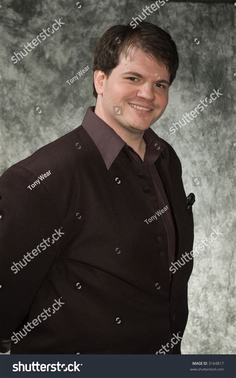 Young Overweight Man Posing In Front Of Portrait Backdrop Stock Photo ...