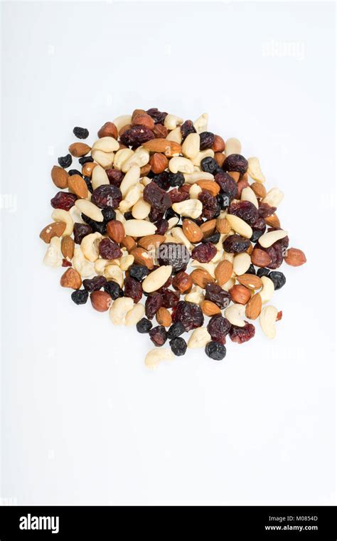 mixed nuts and dried fruits isolated on white background Stock Photo - Alamy