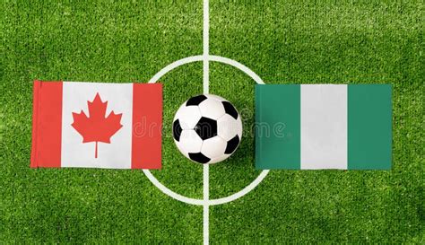 Top View Soccer Ball with Canada Vs. Nigeria Flags Match on Green ...