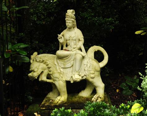 Bodhisattva Manjushri riding a lion, tall headdress, robes… | Flickr