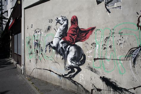 Street artist Banksy splashes Paris with works on migrants