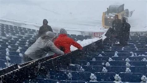 'Push him onto the field!' Fans have fun while shoveling snow at Bills stadium.