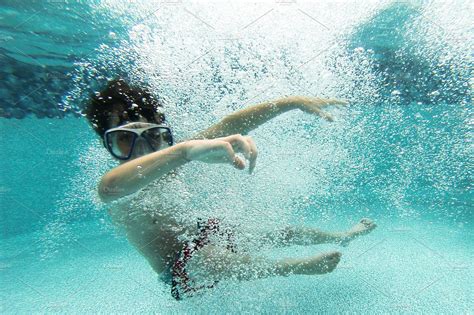 Boy Swimming Underwater | High-Quality Sports Stock Photos ~ Creative ...