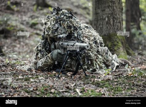 sniper wearing ghillie suit Stock Photo - Alamy